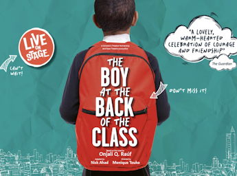 A picture of the back of a boy with his red  backpack.